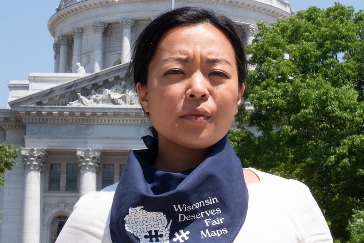 Francesca Hong stands in front of the Wisconsin state capitol building as part of efforts to protest political gerrymandering.